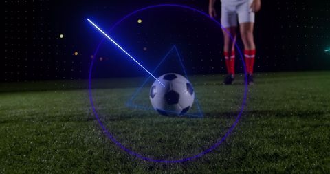 Soccer Player Poised to Kick Ball on Night Field