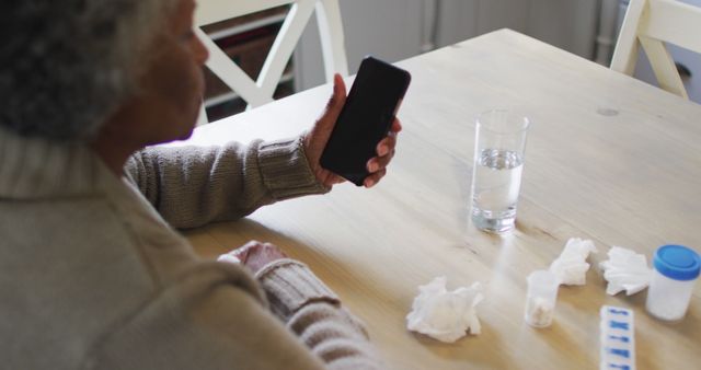 Senior Woman Using Smartphone for Healthcare Management at Home - Download Free Stock Images Pikwizard.com