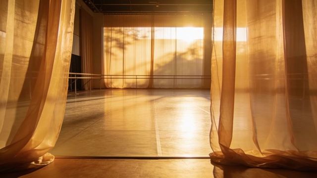 Sheer golden curtains filtering sunlight into ballet studio, warm glow and soft shadows
