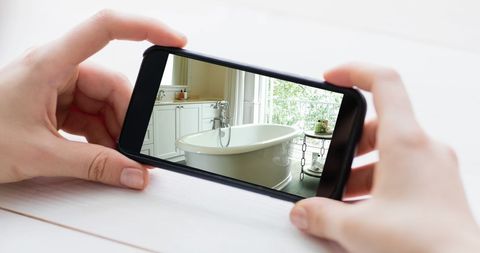Woman Viewing Bathroom on Smartphone Screen - Download Free Stock Images Pikwizard.com