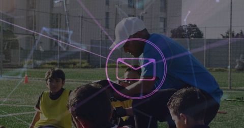 Youth Soccer Team Coaching on Field with Dynamic Overlay
