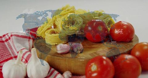 Featuring rustic pasta nests, ripe tomatoes and garlic on wooden board with global map hud overlay