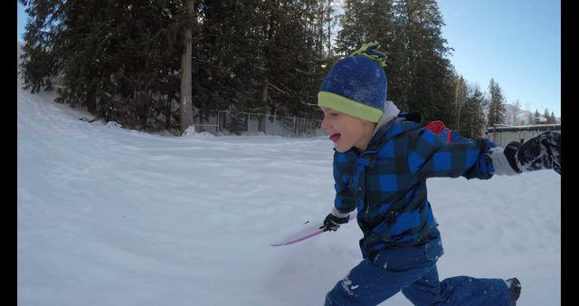 Joyful Child Playing Outdoors in Winter Snow - Download Free Stock Images Pikwizard.com