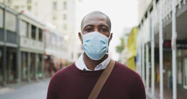 Man Wearing Face Mask on City Street - Download Free Stock Images Pikwizard.com