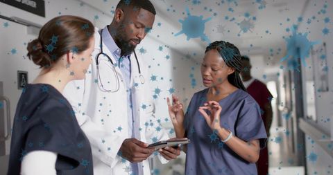 Healthcare Professionals Discussing in Hospital Surrounded by Viral Particles - Download Free Stock Images Pikwizard.com