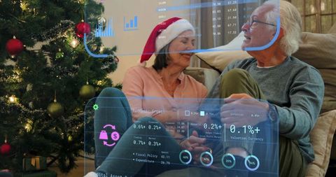 Senior couple reviewing holiday finance dashboards with augmented reality overlay
