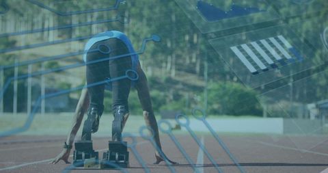 Athlete with prosthetic blades on track with digital overlay