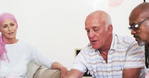 Senior Friends Celebrating Cancer Survival, Sharing Joyful Moments Together