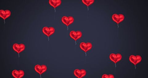 Floating Red Heart Balloons Against Dark Background