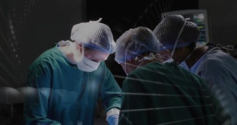 Surgical team performing delicate cardiovascular surgery in sterile modern operating room
