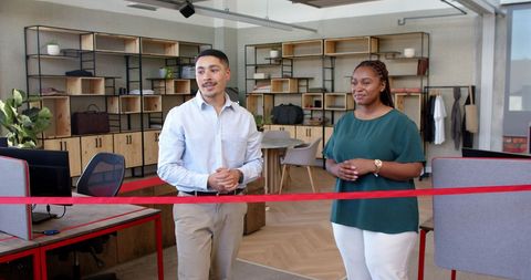 Business colleagues celebrate grand opening with ribbon cutting