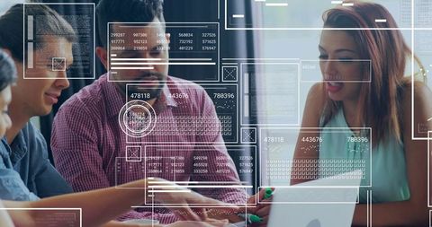 Team Collaborating with Digital Interfaces in Modern Office