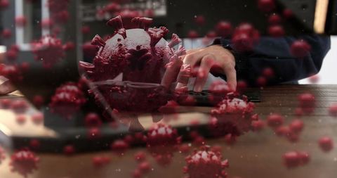 Businesswoman working amidst digital coronavirus animation