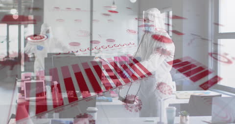 Health Worker Disinfecting Workspace Against COVID-19 With Data Overlay