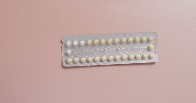 Image of close up of yellow tablets on pink background - Download Free Stock Photos Pikwizard.com