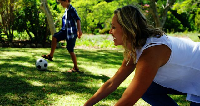 Mother and Son's Playful Moment in Green Park - Download Free Stock Images Pikwizard.com