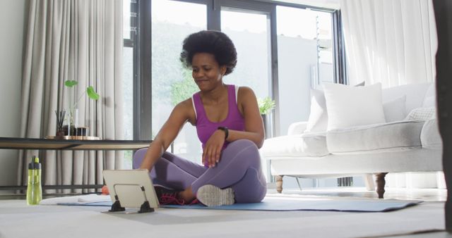 Woman in Activewear Happy after Home Workout in Living Room - Download Free Stock Images Pikwizard.com