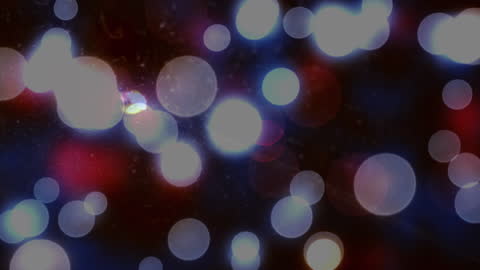 Bokeh Light Sparkles Over Celebrating Crowd