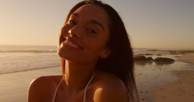 Happy Woman Smiling at Sunset on Beach - Download Free Stock Images Pikwizard.com