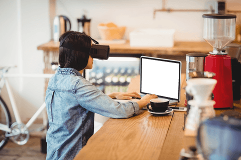 Transparent Young Woman Working on Laptop with Virtual Reality Headset