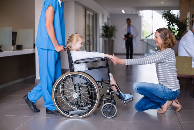 Happy mother meeting her disable daughter in hospital corridor