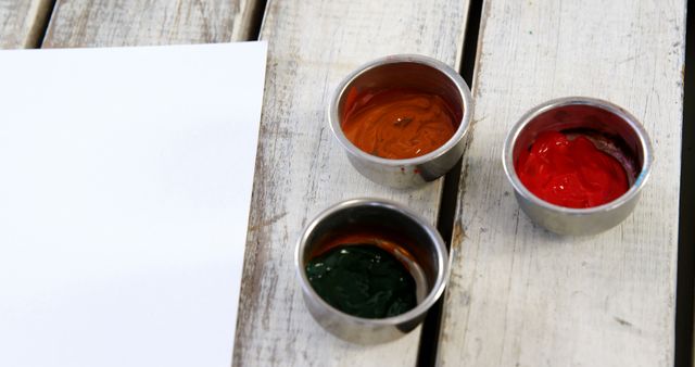 Bowls of Paint on Wooden Surface with Blank Paper - Download Free Stock Images Pikwizard.com