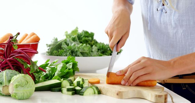 Person Slicing Fresh Vegetables in Modern Kitchen with Bright Background - Download Free Stock Images Pikwizard.com