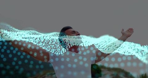 Man embracing freedom on dunes with cyan data wave overlay conceptual nature tech fusion