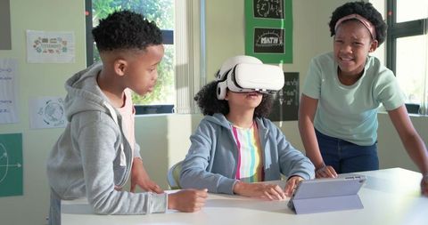 African American Students Using VR Headset in Collaborative Classroom STEM Lesson
