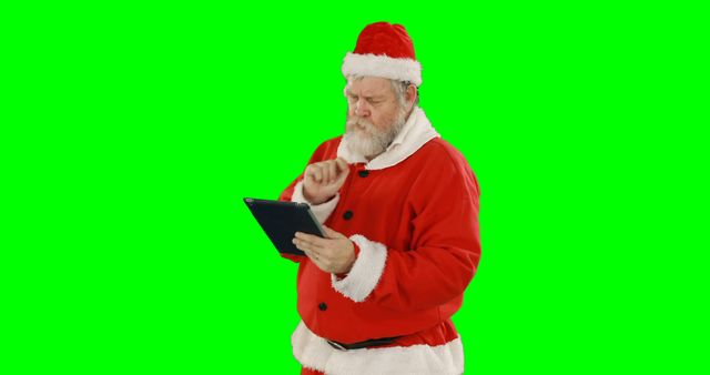 Santa Claus Using Tablet with Green Screen Background - Download Free Stock Images Pikwizard.com