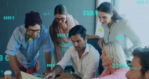 Diverse Team Collaborating with Financial Data on Screen