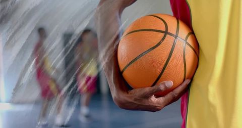 Basketball Player Ready for Game on Indoor Gym Court