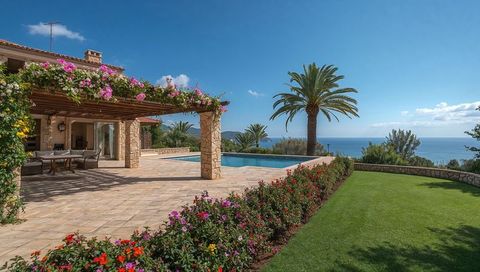 Mediterranean terrace overlooking infinity pool and sea with pergola, dining set and palm