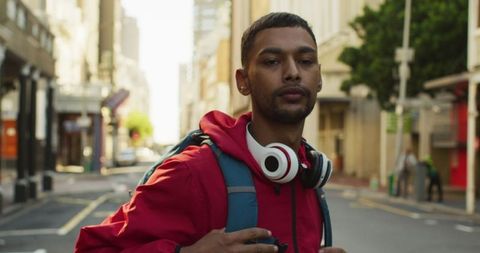 Confident Traveler Exploring Urban Streets with Headphones
