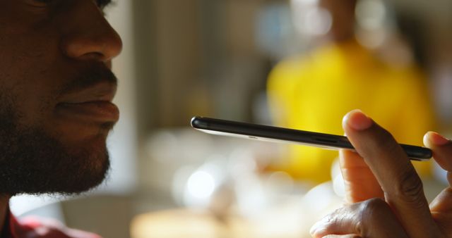 Man Using Voice Command on Smartphone Close-up in Warm Atmosphere - Download Free Stock Images Pikwizard.com