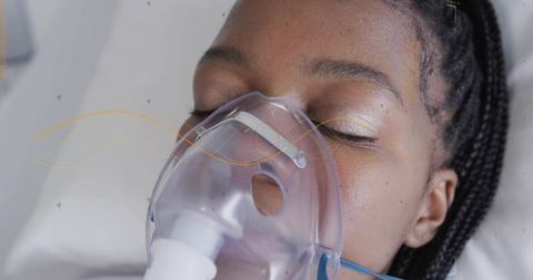 Closeup female patient receiving oxygen mask resting on hospital bed with braided hair