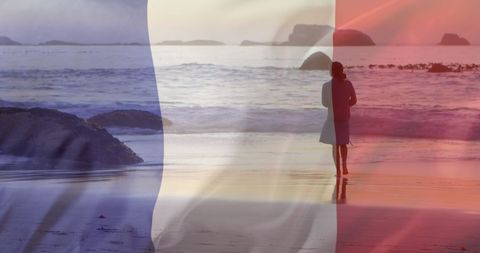 French Flag Overlay on Woman Walking by Seaside