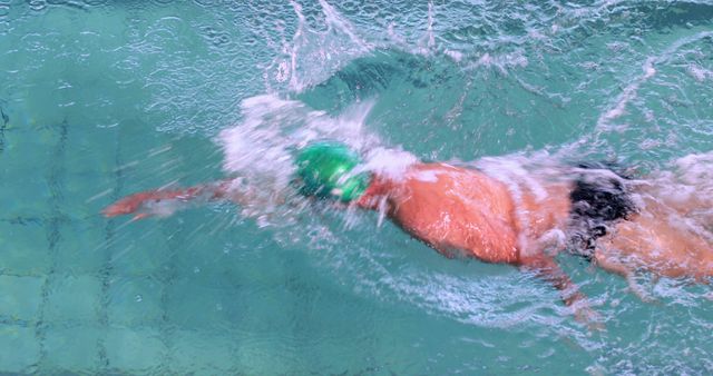 Man Swimming Freestyle in Clear Blue Water Pool - Download Free Stock Images Pikwizard.com