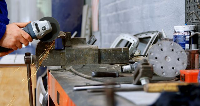 Industrial Mechanic Using Grinder in Workshop - Download Free Stock Images Pikwizard.com