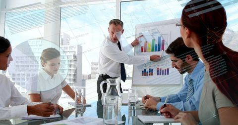 Business Leader Presenting Graph Analysis to Team in Modern Office - Download Free Stock Images Pikwizard.com