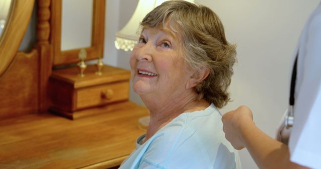 Smiling Elderly Woman Receiving Shoulder Massage at Home - Download Free Stock Images Pikwizard.com