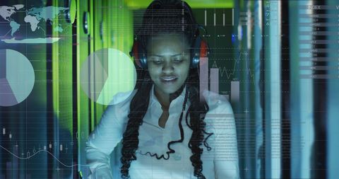 focused it engineer analyzing data in server room with futuristic overlay - Download Free Stock Images Pikwizard.com