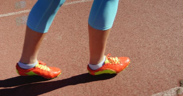 Runner's Legs in Bright Sport Shoes on Track - Download Free Stock Images Pikwizard.com