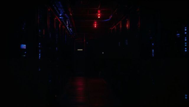 Dimly lit data center with led-illuminated server racks