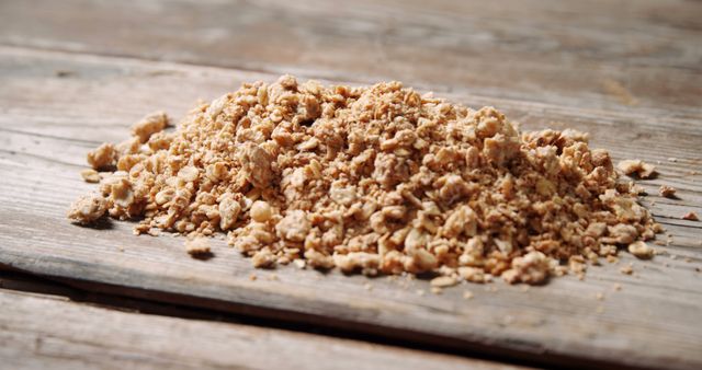 Pile of Crunchy Granola on Rustic Wooden Table - Download Free Stock Images Pikwizard.com
