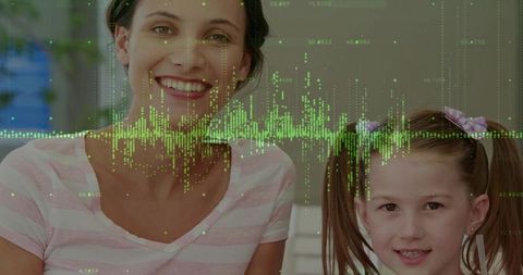 Smiling mother and daughter with digital waveform overlay