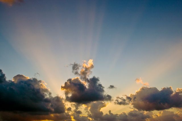 Sun Rays Breaking Through Dramatic Clouds at Sunset - Download Free Stock Photos Pikwizard.com