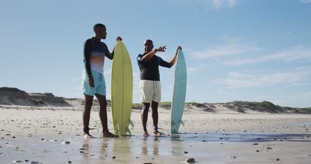 Father and Son Preparing to Surf at Sunny Beach - Download Free Stock Images Pikwizard.com