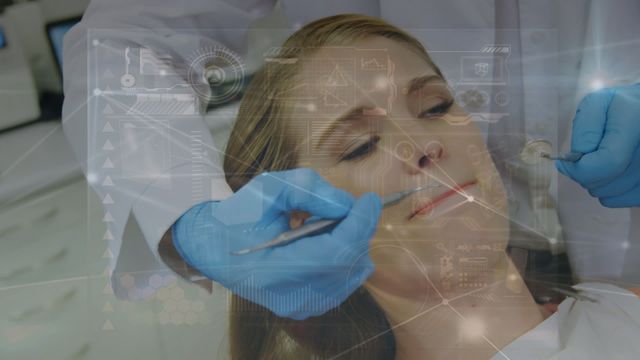 Futuristic scene showing a dentist examining a patient's teeth using augmented reality technology. Suitable for healthcare technology articles, futuristic medical practices, advancements in dentistry, or dental care innovations.