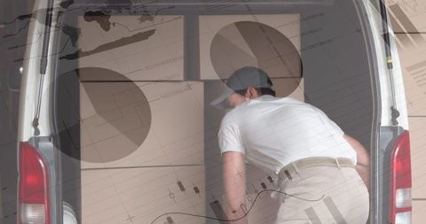 Delivery person organizing boxes in van with transportation data